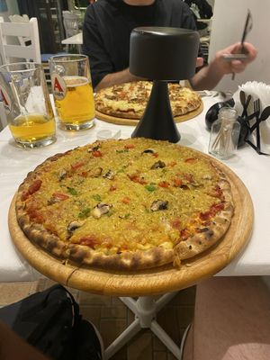 Vegetarian pizza with cheese swapped for vegan cheese  at Taverna Mezedofolia in Crete