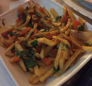 Batatas Janet marinated in oil, with onions and peppers. at Sabores do Sebouh in Porto