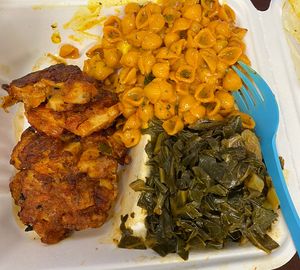 Salt fish fritters with Mac n cheese and collards 😋  at Nate & Natalia's in Tallahassee