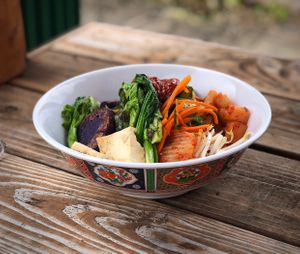 Vegan bi bim bap: a perfect combination of cooked black rice, lightly steamed veggies, raw veggies and house made pickles topped with a dollop of vegan hot sauce (if desired)   at Harmoni Foods in Honokaa