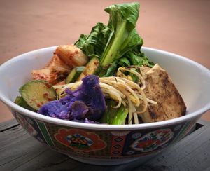 Vegan Bi Bim Bop with tofu, purple potatoes, black rice, kim chee, and various fresh local veggies.   at Harmoni Foods in Honokaa