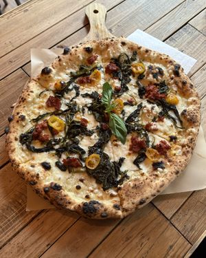 𝐅𝐫𝐢𝐚𝐫𝐞𝐥𝐥𝐢 - White base with Mozzarella (vegan), Friarelli (Italian broccoli), Vegan n’duia, yellow semi-dried Tomatoes, red chilli and fresh Basil   at Pizza by Vinnie - The Oil Basin Brewhouse in Worcester