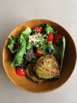 Veg bowl of beans burger and salad at Between Tides in Lobitos