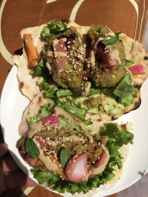 Vegan tortillas with bean burgers, pickles and veggies at Between Tides in Lobitos