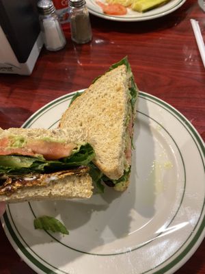 ELT (eggplant bacn, lettuce, tomato) with avacado and v mayo, on 7 grain bread  at Green Lotus Cafe in Hyannis