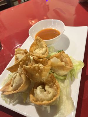 Golden wontons with orange dip sauce   at World Vegan Cuisine in St Petersburg