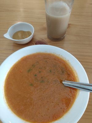 Tomato soup, tiny dessert and glass of coconut milk at Equilibrio Natural in Pereira
