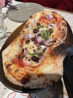 Pizza with olives, capers, red onion   at Vegitalian in Amsterdam
