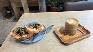 Hummus+kimchi sandwich and cappuccino with Not Milk  at Café Área in Santiago
