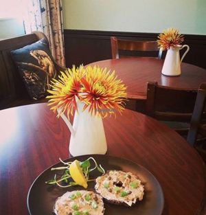 Faux Lox - mock salmon on a raw bagel with green onions, dill and capers, served with sprouts and lemon.   at The Green Eatery in Milton