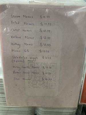 Menu promoting Momos and other dishes   at Momo Hub in Brampton