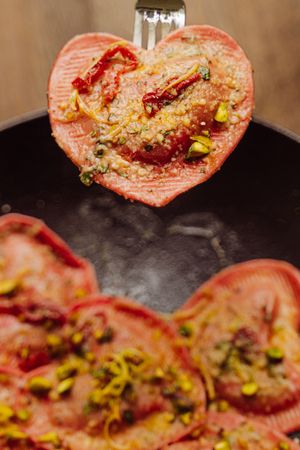 Heart-shaped Red Beet Ravioli filled with Pistachio and Figs enriched with lemon and agave. Mouthwatering, sophisticated and like nothing you have ever tried before. at Primo Pasta Amsterdam in Amsterdam