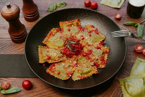 Ravioli filled with spinach and accompanied by fresh and juicy tomato sauce. So yummy! at Primo Pasta Amsterdam in Amsterdam