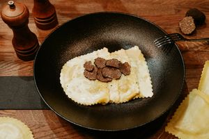 Ravioli Pasta with truffles inside, outside, just everywhere. Accompanied by creamy pine nuts. A dish for true Truffle lovers! at Primo Pasta Amsterdam in Amsterdam