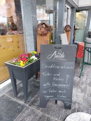 Exterior of the place with sign at Café Amadé in Riezlern