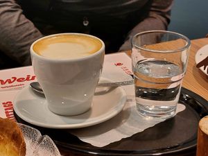 Cappuccino with oat milk at Café Amadé in Riezlern