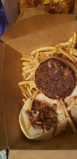 a burger that is doesn't have everything on it to resemble the the town or backyard bbq burgers. and I was supposed to have 2 burgers, only got this one. barely any fries as well at The Happy Hooligans in San Jose