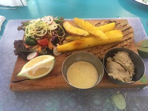 Milanesa de quinoa with baba ghanoush and salad and chips at Chirimoya in Salta