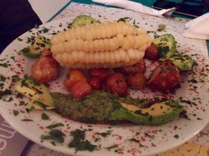 Andean potatoes, heirloom corn, huancaina basil sauce and avocado at Chirimoya in Salta