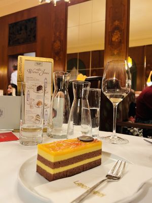 Mangoschnitte (vegan cake with chocolate base, hazelnut cake, mango dairy-free cream and a mango jelly topping!)   at Café Landtmann in Vienna