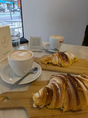 Croissant simple and apple filled croissant. Soya cappuccinos. at O Melhor Croissant da Minha Rua - Alameda in Lisbon