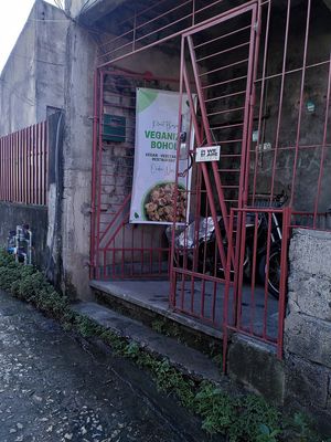 The entrance is on the left side of the building, through the gate at Veganize Bohol in Tagbilaran
