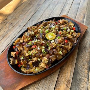 Our best selling sizzling tofu sisig! Savory sauce, zesty lime, fresh scallions. at Veganize Bohol in Tagbilaran