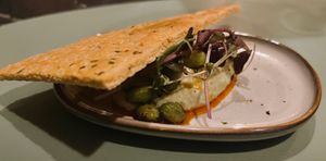 Apero hapje op basis van sojacréme en een huisgemaakte cracker at Eethuis Lamoen in Landegem