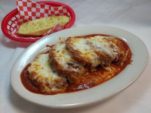 Eggplant Parmesan - our number 1 selling entrée 16 years running! at Fino Restaurant and Catering in Dallas