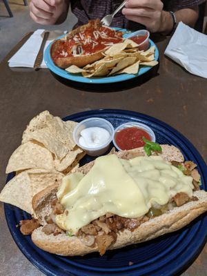Cheesesteak with soy cheese and meatball sub  at One World Cafe in Baltimore