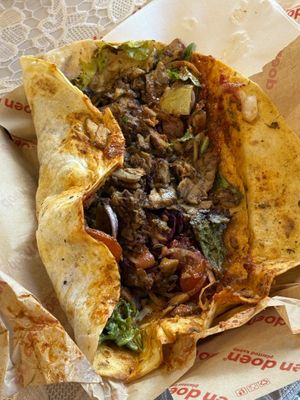 Opened Yufka to see all the ingredients and sauces inside. Big portion.   at doen doen® kebap in Berlin