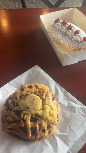 Cheeseymite scroll and cream bun  at Made with Love Bakery in Southport