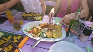 Platter in the middle, fried tofu and fried tempeh on the left at Artha in Porec
