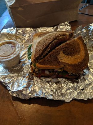 "Mighty Aphrodite" sandwich (no feta) on marble rye with a side of vegan potato salad at Red Hook Coffee and Tea in Philadelphia