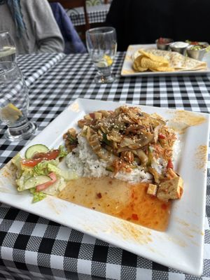 Magic Wok of Tibet with gloppy sauce and minimal salad.   at Elita - temporarily closed in Canmore
