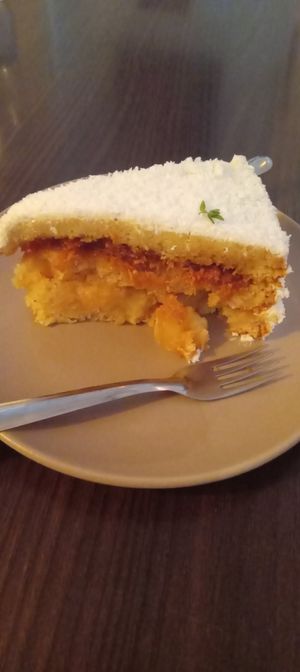 Bolo de abacaxi com coco queimado at  Café Angélica in Porto Alegre