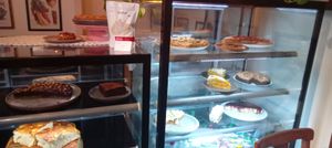 Opções de bolos, tortas e pães do dia at  Café Angélica in Porto Alegre