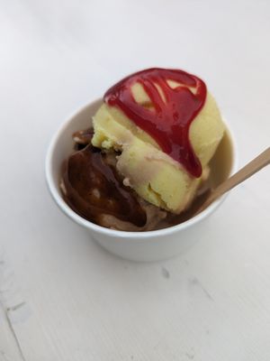 A scoop each of Hazelnut and Lemon Pie ice cream with syrups at Grashka Deli in Ljubljana
