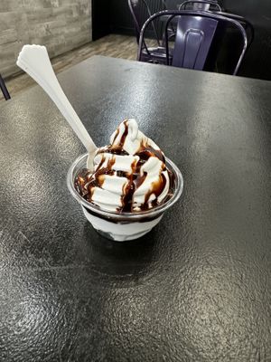 Soft serve vanilla with chocolate sauce. Also have pineapple, and swirl. Different days of the week Watermelon, strawberry, mango and rarely pomegranate  at Cinnaholic in Visalia