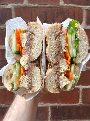 Banhtl's Lanhtl's: a vegan Banh Mi-inspired sandwich featuring Five Spice Lentil Walnut Pate, Roasted Tofu, House Banh Mi Mayo, Cucumber, House Pickled Carrots, Jalapeno, Cilantro at Cleo Bagels in Philadelphia