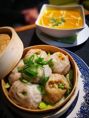 two first courses: far back - seasonal pumpking soup, up front - Momo, which is a type of South Asian dumpling at Pod Norenami in Krakow
