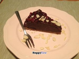 Chocolate cheesecake with berries and almonds at Pod Norenami in Krakow