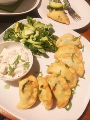 Spinach and tofu dumplings and vegan sauce at Pod Norenami in Krakow