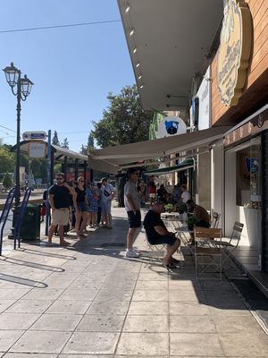 Outside shop: a few small tables for outdoor seating  at Coffee Lab - Sýntagma in Athens