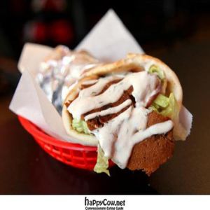 gyro: seasoned homemade seitan w/ lettuce, tomato, red onion, and vegan tzatziki sauce wrapped in flatbread at Foodswings in Brooklyn