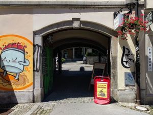 Square entrance. The restaurant is inside. at Ajdovo Zrno in Ljubljana