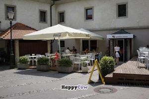 Outside seating and entrance to Ajdovo zrno. at Ajdovo Zrno in Ljubljana