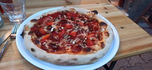 Tomato base, tomatoes(dried and fresh), red pepper(Solanaceae pizza) , almonds and vegan mozza at Oncle Heraclite Pizza in Clermont-ferrand