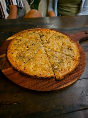 Gluten free vegan cheesy garlic pizza.  at Harry's Beach Bistro in Caloundra