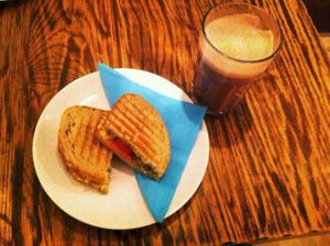 Tomato, pesto and cheese sandwich + hot chocolate with oat milk at DopHert in Amsterdam